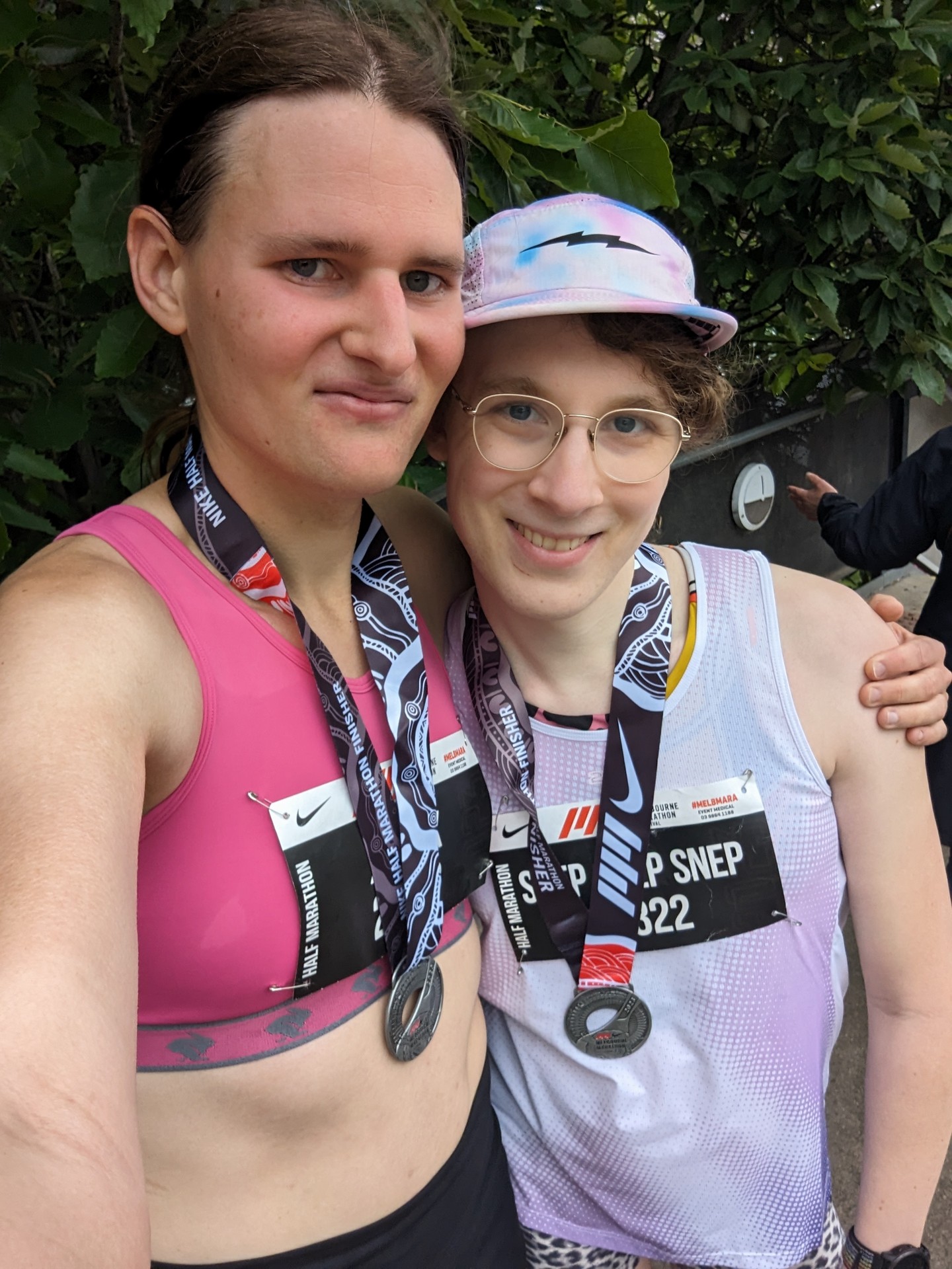 Selfie of Alex and myself with finishing medals post run