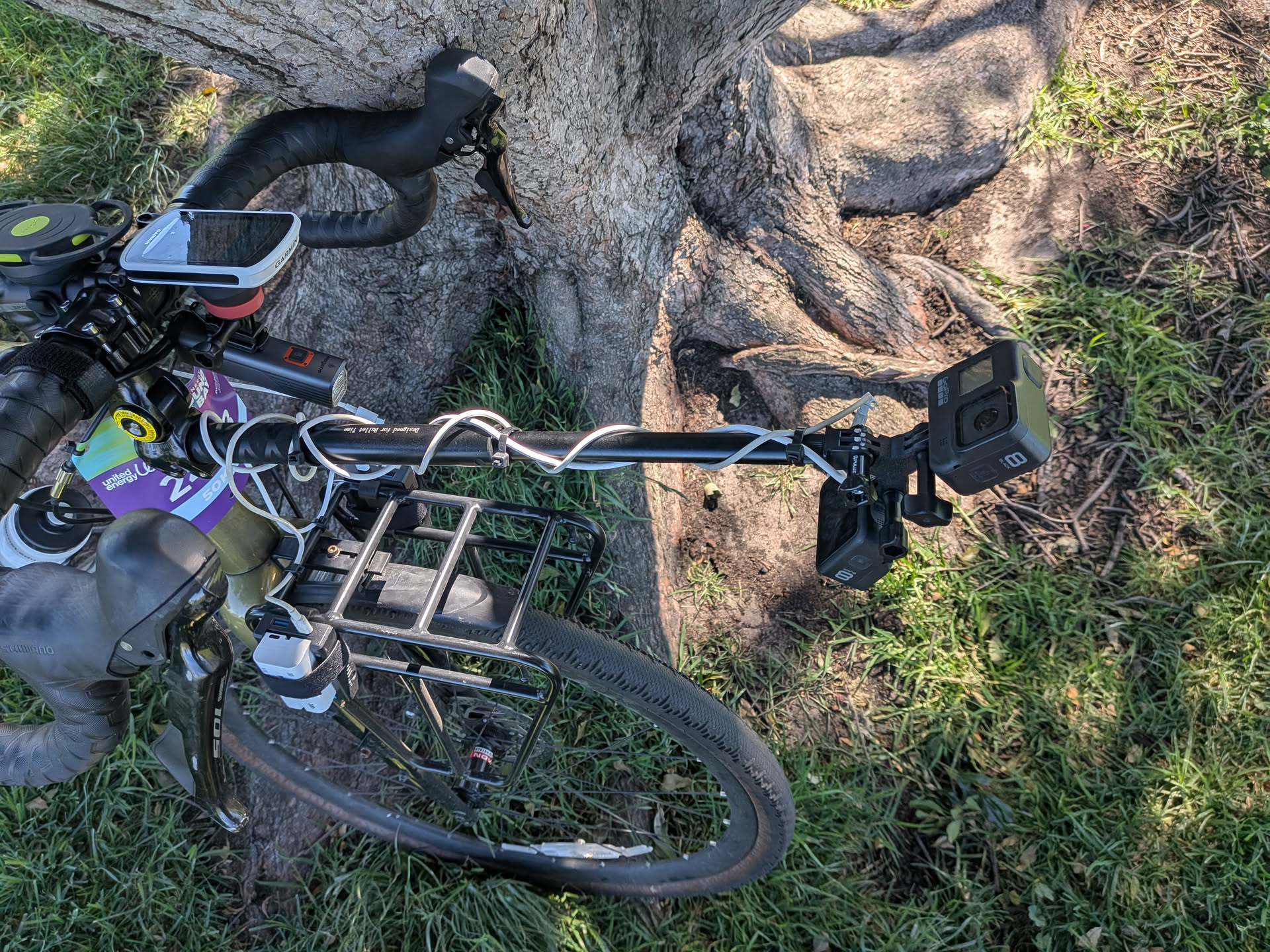 Pole connected to the handlebar of the bike and two gopros mounted on the end