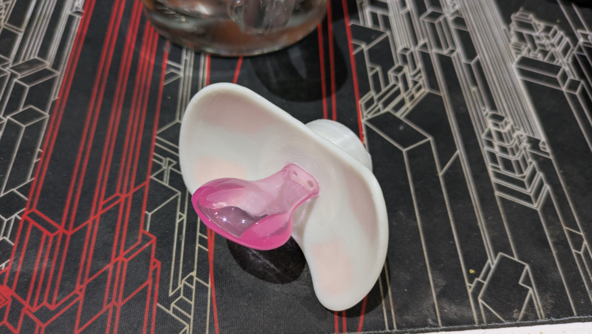 Picture of the smart paci, white adult sized paci that&rsquo;s been 3d printed.
