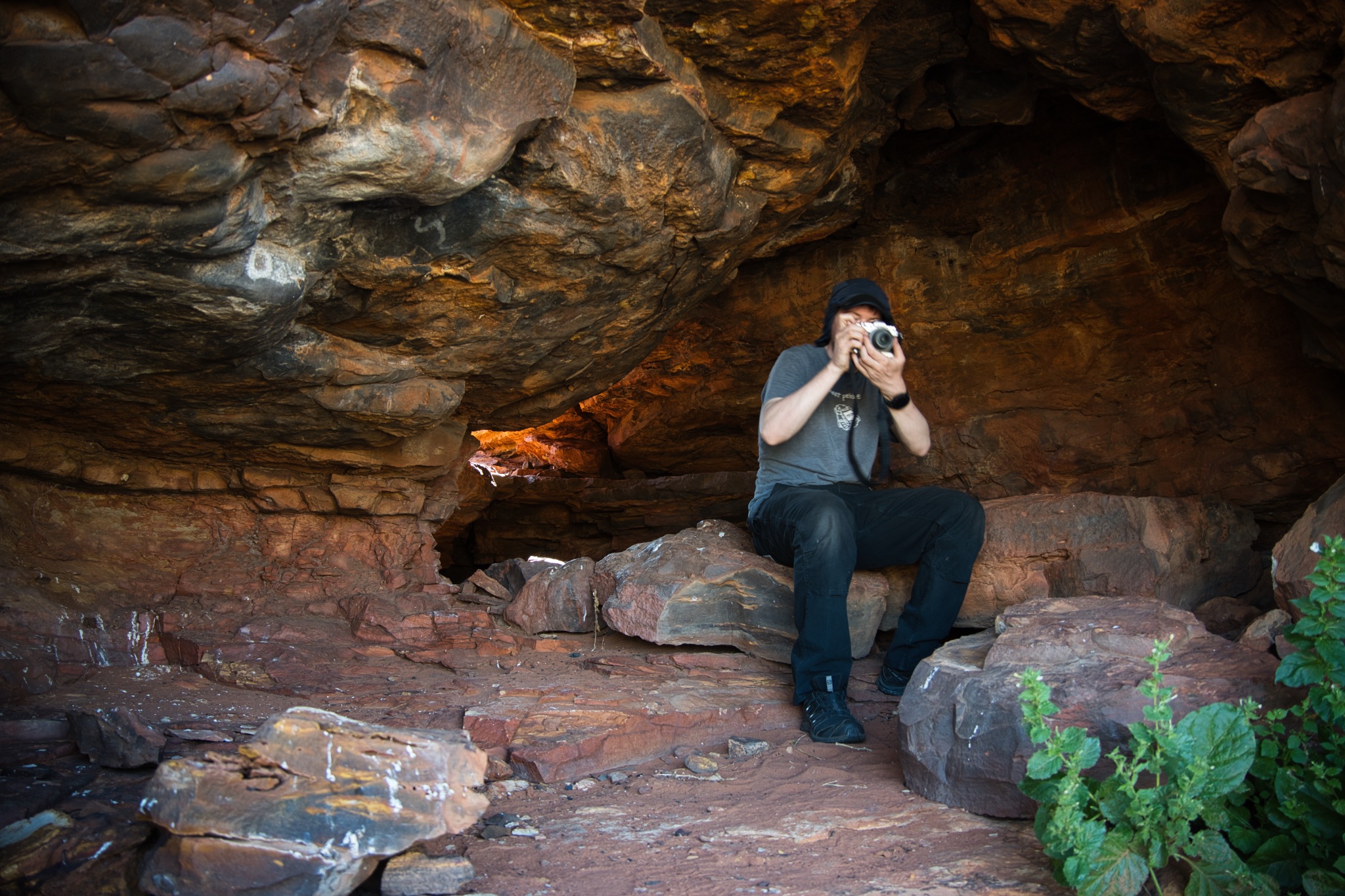 Rock art cave with Droppy taking a photo