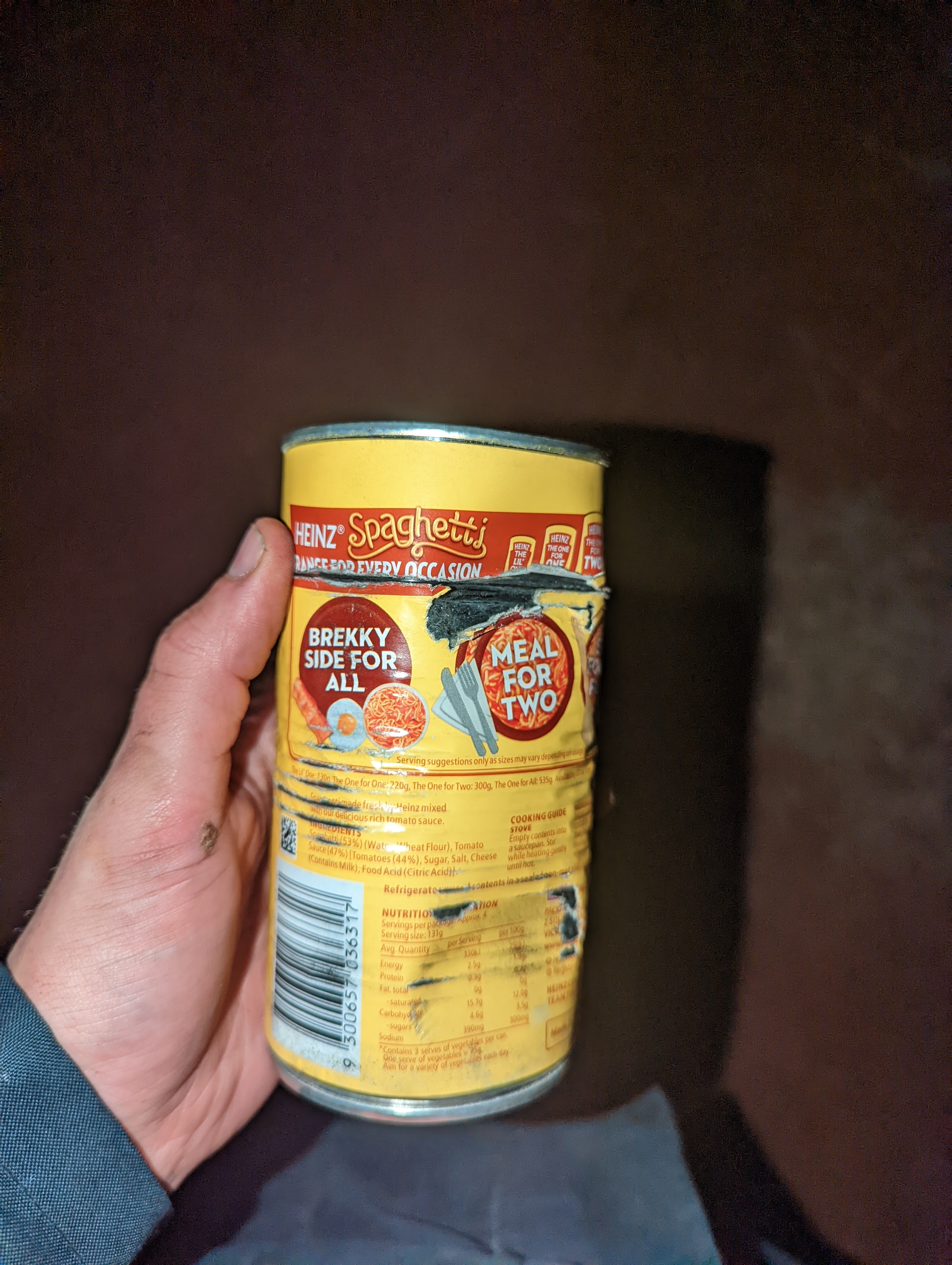 Damaged tinned spaghetti tin. Dinted and cut