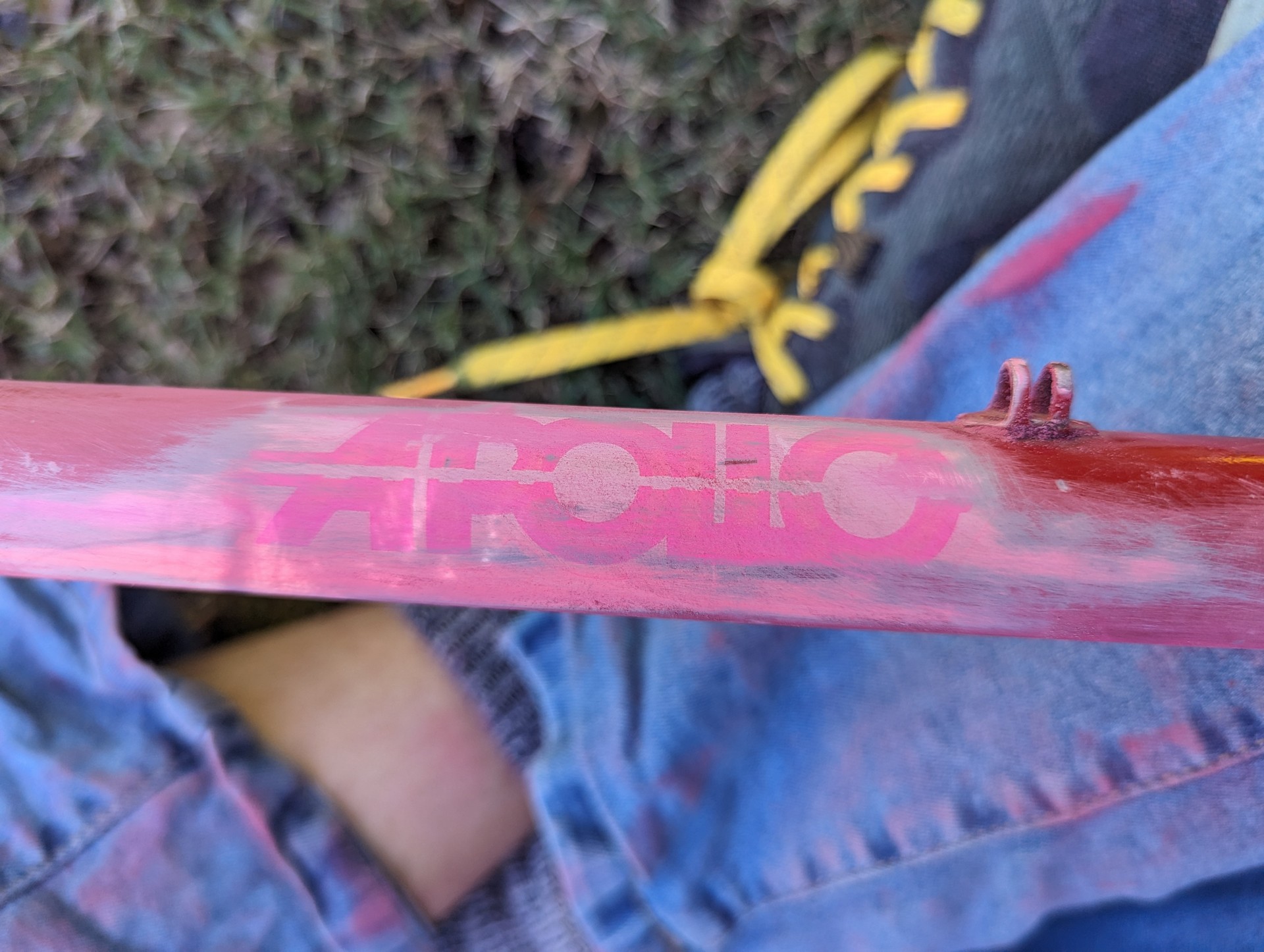 Sanded back paint revealing pink apollo logo