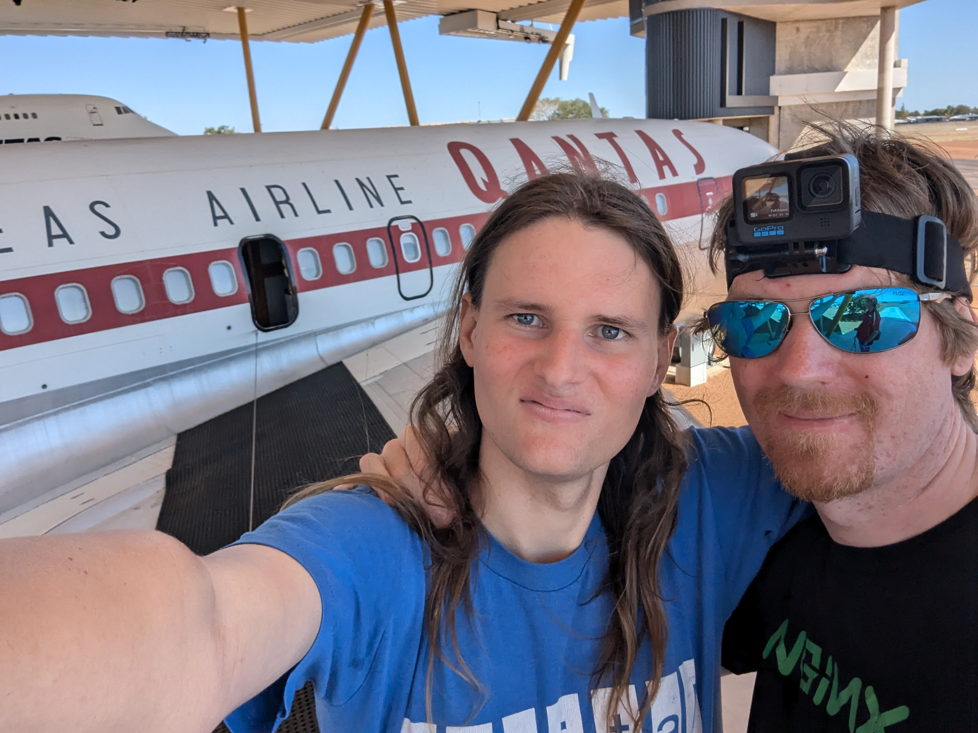 selfie of myself and geordie standing on the wing of an aircraft at the qantas muesum