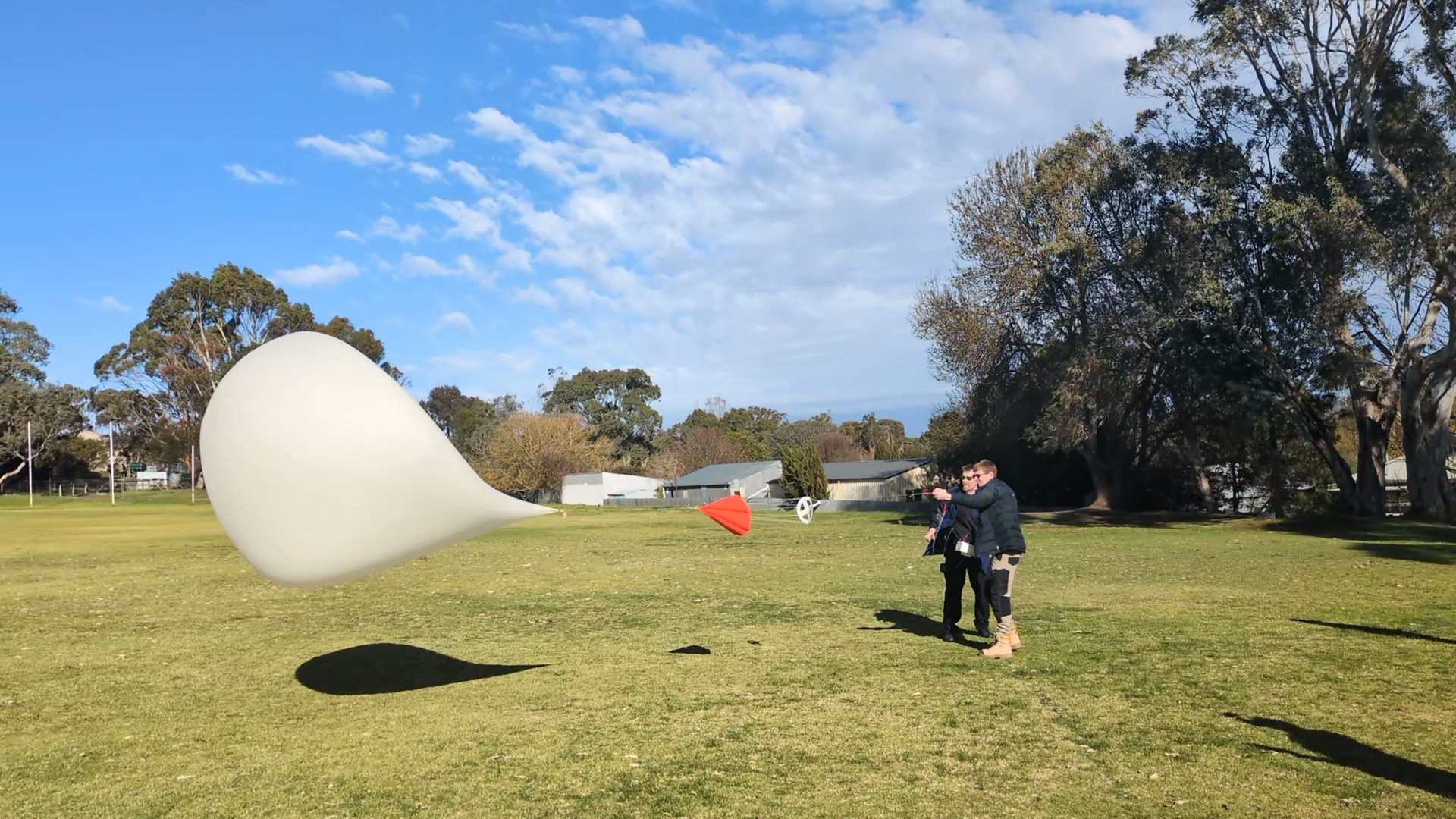 Balloon being pulled sideways by a gust of wind
